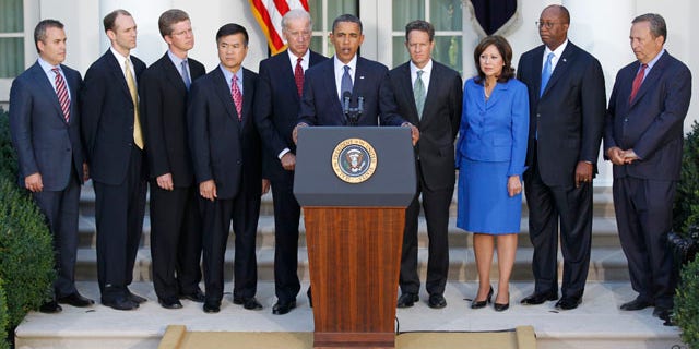 Sept. 15: President Obama, center, speaks with members of his economic team, on the economy in the Rose Garden of the White House in Washington.