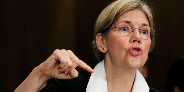 FILE: July 21, 2011: Elizabeth Warren, as head of the Congressional Oversight Panel, testifies before a Senate Finance Committee.