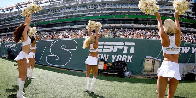 EAST RUTHERFORD, NJ - SEPTEMBER 07: The New York Jets Flight Crew cheerleaders perform during the fourth quarter of a game between the New York Jets and the Oakland Raiders at MetLife Stadium on September 7, 2014 in East Rutherford, New Jersey. (Photo by Ed Mulholland/Getty Images)