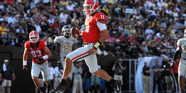 Sep 12, 2015; Nashville, TN, USA; Georgia Bulldogs quarterback Greyson Lambert (11) runs in for a touchdown during the second half against the Vanderbilt Commodores at Vanderbilt Stadium. Georgia won 31-14. Mandatory Credit: Christopher Hanewinckel-USA TODAY Sports