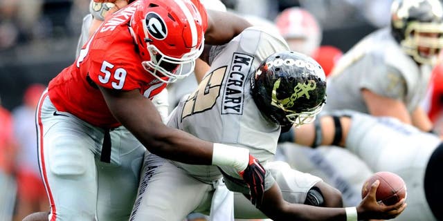 Sep 12, 2015; Nashville, TN, USA; Vanderbilt Commodores quarterback Johnny McCrary (2) is sacked by Georgia Bulldogs linebacker Jordan Jenkins (59) during the first half at Vanderbilt Stadium. Mandatory Credit: Christopher Hanewinckel-USA TODAY Sports