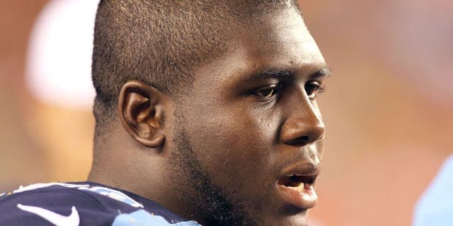 Aug 17, 2013; Cincinnati, OH, USA; Tennessee Titans offensive guard Chance Warmack (70) watches from the sidelines during a game against the Cincinnati Bengals at Paul Brown Stadium. Mandatory Credit: Brian Spurlock-USA TODAY Sports