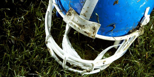 Football helmet on grass