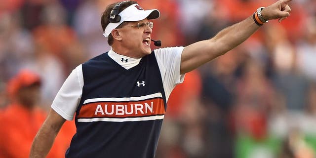 MANHATTAN, KS - SEPTEMBER 18: Head coach Gus Malzahn of the Auburn Tigers calls out instructions against the Kansas State Wildcats during the first half on September 18, 2014 at Bill Snyder Family Stadium in Manhattan, Kansas. (Photo by Peter G. Aiken/Getty Images)