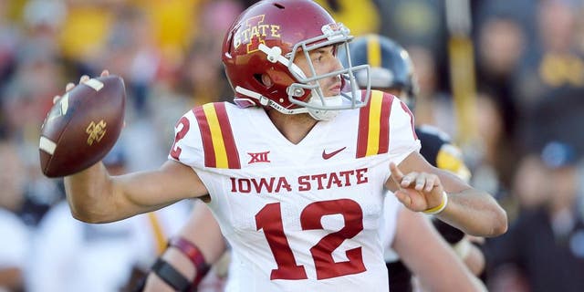 Iowa State quarterback Sam B. Richardson throws a pass during the second half of an NCAA college football game against Iowa, Saturday, Sept. 13, 2014, in Iowa City, Iowa. Iowa State won 20-17. (AP Photo/Charlie Neibergall)