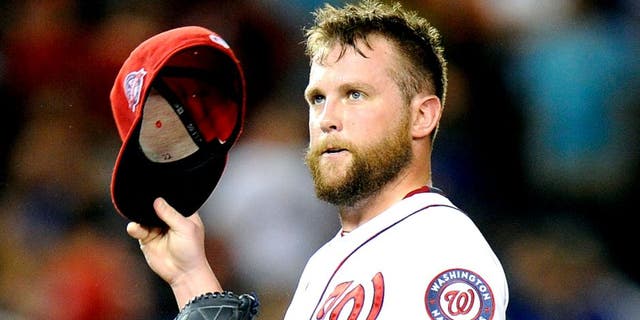 WASHINGTON, DC - SEPTEMBER 08: Drew Storen #22 of the Washington Nationals reacts after walking in a run in the seventh inning against the New York Mets at Nationals Park on September 8, 2015 in Washington, DC. New York won the game 8-7. (Photo by Greg Fiume/Getty Images)