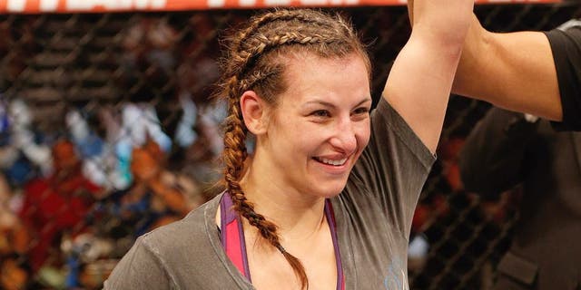 ORLANDO, FL - APRIL 19: Miesha Tate reacts after her decision victory over Liz Carmouche in their women's bantamweight bout during the FOX UFC Saturday event at the Amway Center on April 19, 2014 in Orlando, Florida. (Photo by Josh Hedges/Zuffa LLC/Zuffa LLC via Getty Images)