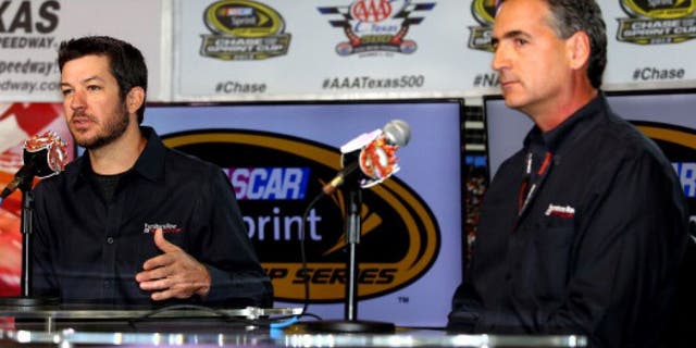FORT WORTH, TX - NOVEMBER 01: (L-R) Driver Martin Truex is presented as the next driver of the #78 Furniture Row / Denver Mattress Chevrolet by Joe Garone, general manager of Furniture Row Racing, at Texas Motor Speedway on November 1, 2013 in Fort Worth, Texas. (Photo by Todd Warshaw/NASCAR via Getty Images)