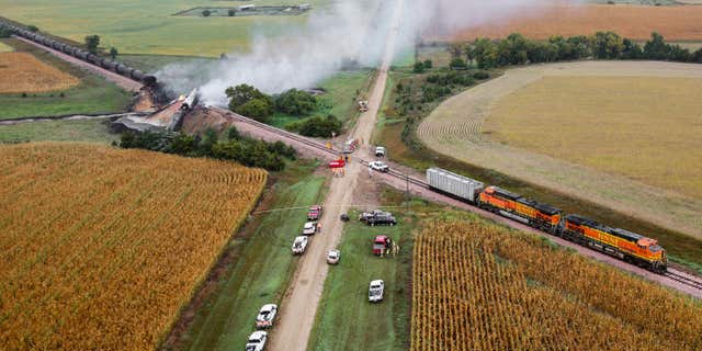 Smoke rises from a burning ethanol tanker car, Saturday Sept. 19, 2015, after the 98-car BNSF train carrying ethanol derailed in a rural part of Bon Homme County awash in corn fields between the towns of Scotland and Lesterville, S.D.