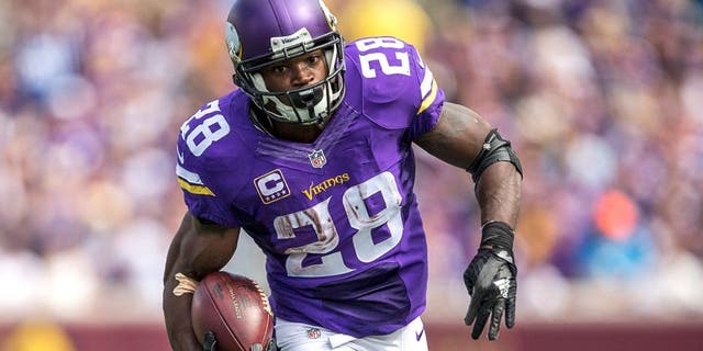 Sep 20, 2015; Minneapolis, MN, USA; Minnesota Vikings running back Adrian Peterson (28) rushes with the ball in the second half against the Detroit Lions at TCF Bank Stadium. The Vikings won 26-16. Mandatory Credit: Jesse Johnson-USA TODAY Sports