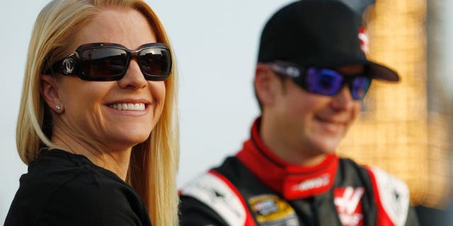 CHARLOTTE, NC - MAY 22: Patricia Driscoll stands on the grid with Kurt Busch, driver of the #41 Haas Automation Made in America Chevrolet, during qualifying for the NASCAR Sprint Cup Series Coca-Cola 600 at Charlotte Motor Speedway on May 22, 2014 in Charlotte, North Carolina. (Photo by Jeff Zelevansky/NASCAR via Getty Images)