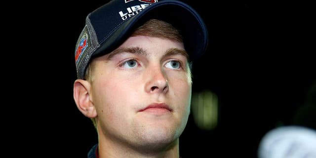 JOLIET, IL - SEPTEMBER 16: William Byron, driver of the #9 Liberty University Toyota, is interviewed on the grid after the NASCAR Camping World Truck Series American Ethanol E15 225 at Chicagoland Speedway on September 16, 2016 in Joliet, Illinois. (Photo by Sarah Crabill/Getty Images)
