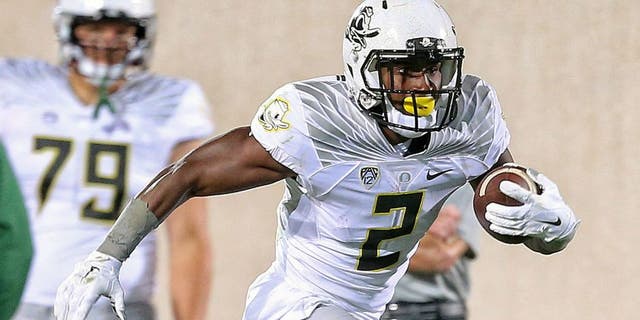 Sep 12, 2015; East Lansing, MI, USA; Oregon Ducks wide receiver Bralon Addison (2) runs for yards after a catch against the Michigan State Spartans during the 1st half of a game at Spartan Stadium. Mandatory Credit: Mike Carter-USA TODAY Sports