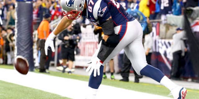 FOXBORO, MA - SEPTEMBER 10: Rob Gronkowski #87 of the New England Patriots spikes the ball to celebrate his touchdown in the second quarter against the Pittsburgh Steelers at Gillette Stadium on September 10, 2015 in Foxboro, Massachusetts. (Photo by Maddie Meyer/Getty Images)
