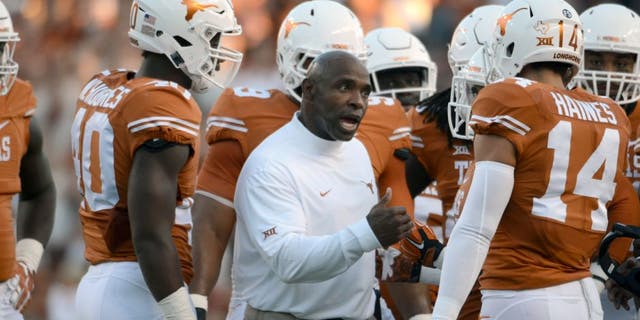 Sep 12, 2015; Austin, TX, USA; Texas Longhorns head coach Charlie Strong (center) talks to his team against the Rice Owls during the first quarter at Darrell K Royal-Texas Memorial Stadium. Mandatory Credit: Brendan Maloney-USA TODAY Sports