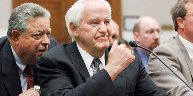 Sept. 22: Hillandale Farms of Iowa President Orland Bethel, right, confers with his lawyer on Capitol Hill in Washington.