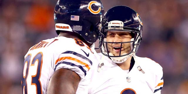 EAST RUTHERFORD, NJ - SEPTEMBER 22: Quarterback Jay Cutler #6 celebrates a touchdown with tight end Martellus Bennett #83 of the Chicago Bears against the New York Jets during a game at MetLife Stadium on September 22, 2014 in East Rutherford, New Jersey. (Photo by Elsa/Getty Images)