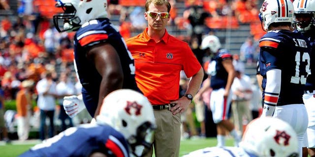 Aug 30, 2014; Auburn, AL, USA; Auburn Tigers offensive coordinator Rhett Lashlee during warm-ups prior to the game against the Arkansas Razorbacks at Jordan Hare Stadium. Mandatory Credit: Shanna Lockwood-USA TODAY Sports