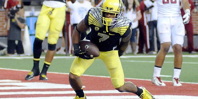Sep 20, 2014; Pullman, WA, USA; Oregon Ducks wide receiver Keanon Lowe (7) scores a touchdown against the Washington State Cougars during the second half at Martin Stadium. The Ducks beat Cougars 38-31. Mandatory Credit: James Snook-USA TODAY Sports