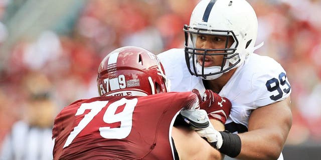 Sep 5, 2015; Philadelphia, PA, USA; Penn State Nittany Lions defensive tackle Austin Johnson (99) tries to break past Temple Owls offensive linesmen Kyle Friend (79) during the second quarter at Lincoln Financial Field. Temple defeated Penn State 27-10. Mandatory Credit: Matthew O'Haren-USA TODAY Sports