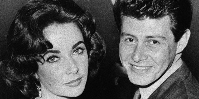 In this 1959 file photo, actress Elizabeth Taylor is seen with singer Eddie Fisher before their marriage. Fisher, whose huge fame as a pop singer was overshadowed by scandals ending his marriages to Debbie Reynolds and Taylor, died Wednesday night, Sept. 22, of complications from hip surgery at a hospital in Berkeley.
