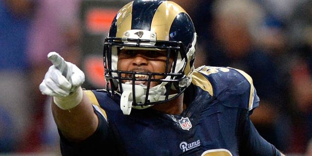 St. Louis Rams defensive tackle Aaron Donald (99) celebrates after sacking Seattle Seahawks quarterback Russell Wilson (not pictured) during the second half at the Edward Jones Dome during a game on Sept. 13, 2015. The Rams defeated the Seahawks 34-31 in overtime. (Jeff Curry-USA TODAY Sports)