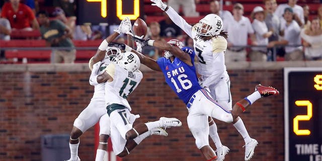 Sep 4, 2015; Dallas, TX, USA; Southern Methodist Mustangs wide receiver Courtland Sutton (16) cannot catch a pass while defended by Baylor Bears safety Terrell Burt (13) and safety J.W. Ketchum (25) and cornerback Tion Wright (3) in the fourth quarter at Gerald J. Ford Stadium. Baylor won 56-21. Mandatory Credit: Tim Heitman-USA TODAY Sports