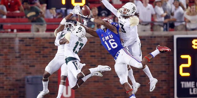 Sep 4, 2015; Dallas, TX, USA; Southern Methodist Mustangs wide receiver Courtland Sutton (16) cannot catch a pass while defended by Baylor Bears safety Terrell Burt (13) and safety J.W. Ketchum (25) and cornerback Tion Wright (3) in the fourth quarter at Gerald J. Ford Stadium. Baylor won 56-21. Mandatory Credit: Tim Heitman-USA TODAY Sports