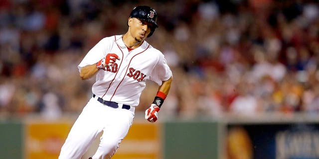 BOSTON, MA - SEPTEMBER 6: Mookie Betts #50 of the Boston Red Sox runs out a triple against the Toronto Blue Jays in the second inning at Fenway Park on September 6, 2014 in Boston, Massachusetts. (Photo by Jim Rogash/Getty Images)
