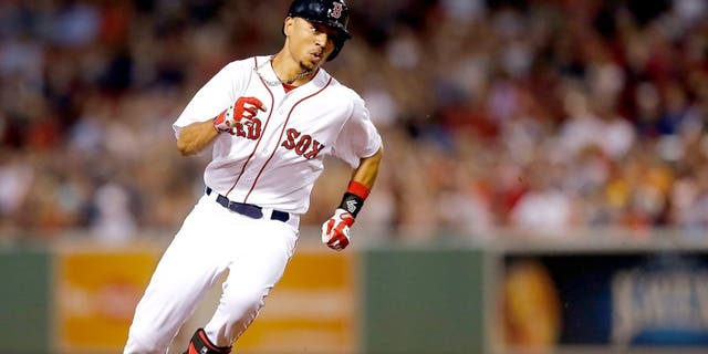BOSTON, MA - SEPTEMBER 6: Mookie Betts #50 of the Boston Red Sox runs out a triple against the Toronto Blue Jays in the second inning at Fenway Park on September 6, 2014 in Boston, Massachusetts. (Photo by Jim Rogash/Getty Images)