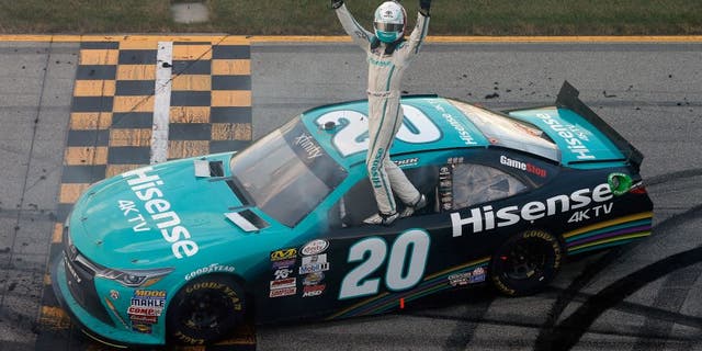 JOLIET, IL - SEPTEMBER 17: Erik Jones, driver of the #20 Hisense Toyota, celebrates after winning the NASCAR XFINITY Series Drive for Safety 300 at Chicagoland Speedway on September 17, 2016 in Joliet, Illinois. (Photo by Brian Lawdermilk/NASCAR via Getty Images)