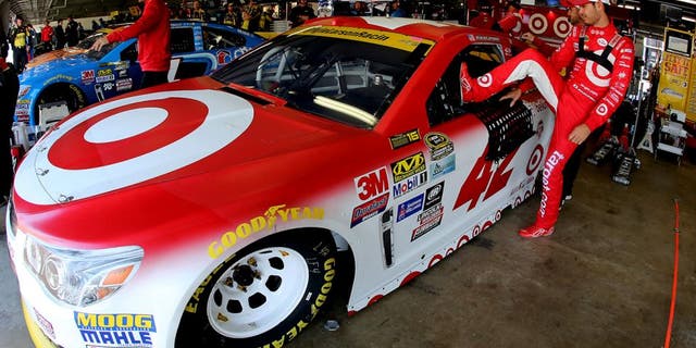 LOUDON, NH - SEPTEMBER 24: Kyle Larson, driver of the #42 Target Chevrolet, climbs into his car during practice for the NASCAR Sprint Cup Series Bad Boy Off Road 300 at New Hampshire Motor Speedway on September 24, 2016 in Loudon, New Hampshire. (Photo by Jerry Markland/Getty Images)