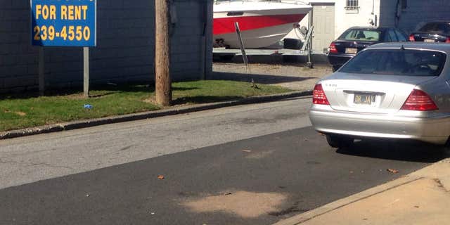 Sept. 24, 2015: The scene of where Delaware police officers fatally shot an armed man in wheelchair after responding to a call that he had a self-inflicted gunshot wound, is seen in Wilmington, Del.
