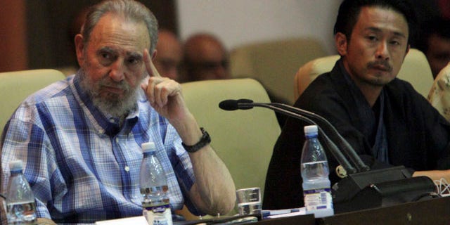 Sept. 21: Cuba's former President Fidel Castro, left, attends a meeting with members of the Peace Boat organization in Havana, Cuba.