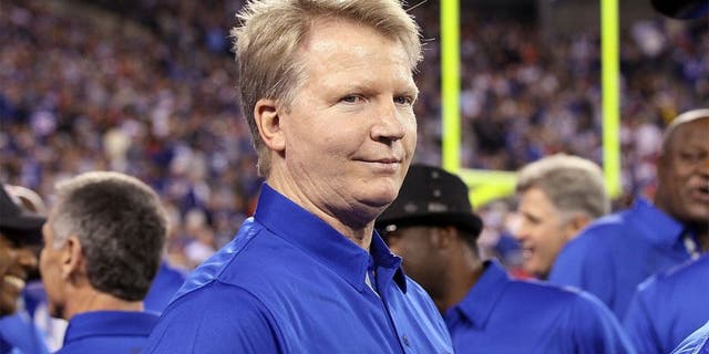 EAST RUTHERFORD, NJ - SEPTEMBER 19: (NEW YORK DAILIES OUT) Former Giant Phil Simms looks on at halftime as the 1986 New York Giants are honored on the 25th anniversary of their Super Bowl winning team on September 19, 2011 at MetLife Stadium in East Rutherford, New Jersey. The Giants defeated the Rams 28-16. (Photo by Jim McIsaac/Getty Images)