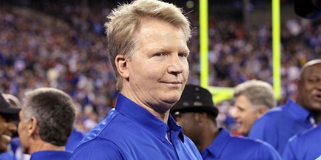 EAST RUTHERFORD, NJ - SEPTEMBER 19: (NEW YORK DAILIES OUT) Former Giant Phil Simms looks on at halftime as the 1986 New York Giants are honored on the 25th anniversary of their Super Bowl winning team on September 19, 2011 at MetLife Stadium in East Rutherford, New Jersey. The Giants defeated the Rams 28-16. (Photo by Jim McIsaac/Getty Images)