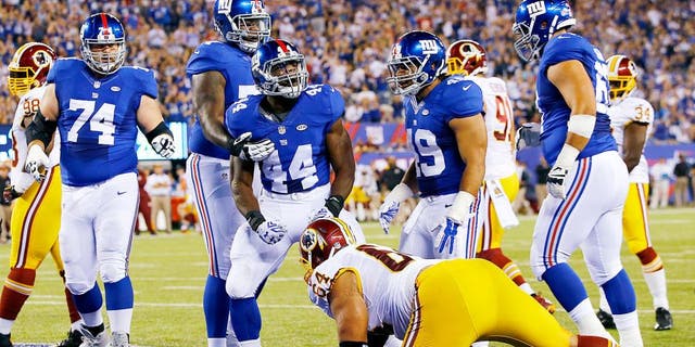 EAST RUTHERFORD, NJ - SEPTEMBER 24: Andre Williams #44 of the New York Giants celebrates his first quarter touchdown against the Washington Redskins at MetLife Stadium on September 24, 2015 in East Rutherford, New Jersey. (Photo by Al Bello/Getty Images)