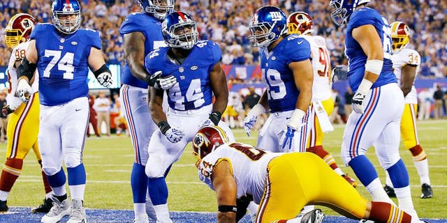 EAST RUTHERFORD, NJ - SEPTEMBER 24: Andre Williams #44 of the New York Giants celebrates his first quarter touchdown against the Washington Redskins at MetLife Stadium on September 24, 2015 in East Rutherford, New Jersey. (Photo by Al Bello/Getty Images)
