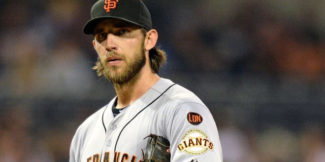 Sep 24, 2015; San Diego, CA, USA; San Francisco Giants starting pitcher Madison Bumgarner (40) looks to the San Diego Padres dugout after right fielder Matt Kemp (not pictured) yelled from the dugout at Petco Park. Mandatory Credit: Jake Roth-USA TODAY Sports