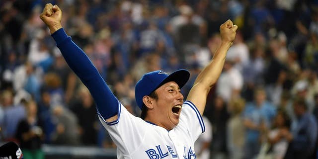 Sep 2, 2015; Toronto, Ontario, CAN; Toronto Blue Jays infielder Munenori Kawasaki (66) reacts to fans cheers during post-game celebrations afterthe Jays defeated Cleveland Indians 5-1 at Rogers Centre. Mandatory Credit: Dan Hamilton-USA TODAY Sports