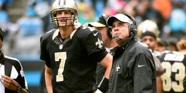 Sep 27, 2015; Charlotte, NC, USA; New Orleans Saints quarterback Luke McCown (7) and head coach Sean Payton on the sidelines in the fourth quarter. The Panthers defeated the Saints 27-22 at Bank of America Stadium. Mandatory Credit: Bob Donnan-USA TODAY Sports
