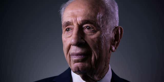 FILE - In this Monday, Feb. 8, 2016 file photo, Israel's former President Shimon Peres poses for a portrait at the Peres Center for Peace in Jaffa, Israel.
