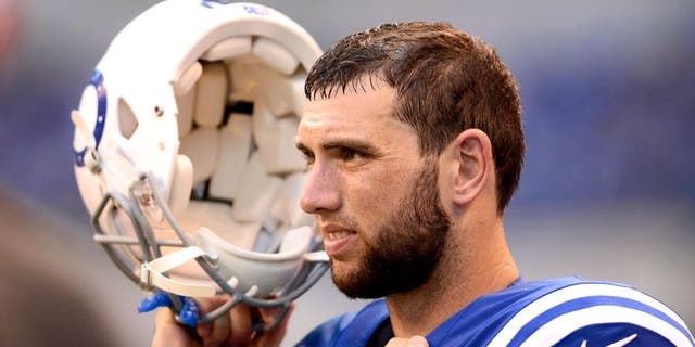 Sep 28, 2014; Indianapolis, IN, USA; Indianapolis Colts quarterback Andrew Luck (12) on the sidelines during the fourth quarter against the Tennessee Titans at Lucas Oil Stadium. Colts defeated the Titans 41-17. Mandatory Credit: Andrew Weber-USA TODAY Sports