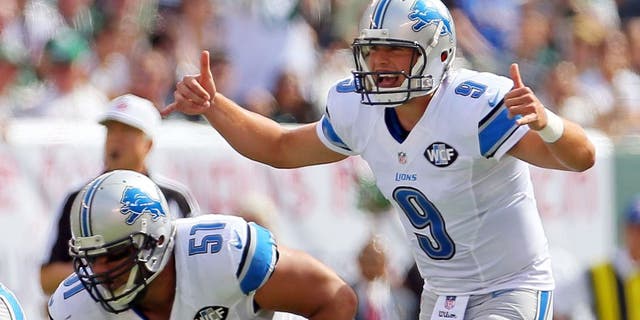 Sep 28, 2014; East Rutherford, NJ, USA; Detroit Lions quarterback Matthew Stafford (9) gestures against the New York Jets during the first quarter at MetLife Stadium. Mandatory Credit: Adam Hunger-USA TODAY Sports