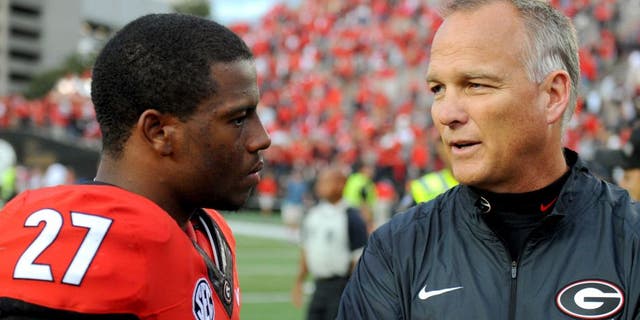 Sep 12, 2015; Nashville, TN, USA; Georgia Bulldogs running back Nick Chubb (27) talks with Georgia Bulldogs head coach Mark Richt after a win against the Vanderbilt Commodores at Vanderbilt Stadium. Georgia won 31-14. Mandatory Credit: Christopher Hanewinckel-USA TODAY Sports