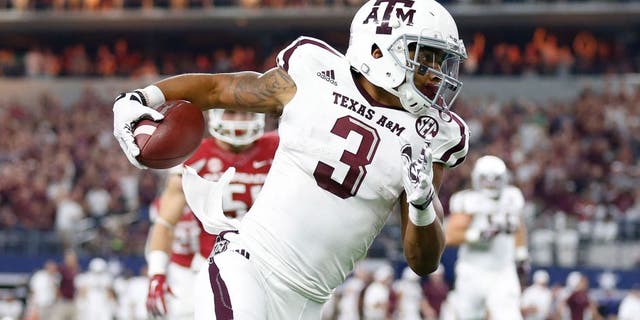 Sep 26, 2015; Arlington, TX, USA; Texas A&M Aggies receiver Christian Kirk (3) runs after a reception in the second quarter against the Arkansas Razorbacks at AT&T Stadium. Mandatory Credit: Matthew Emmons-USA TODAY Sports