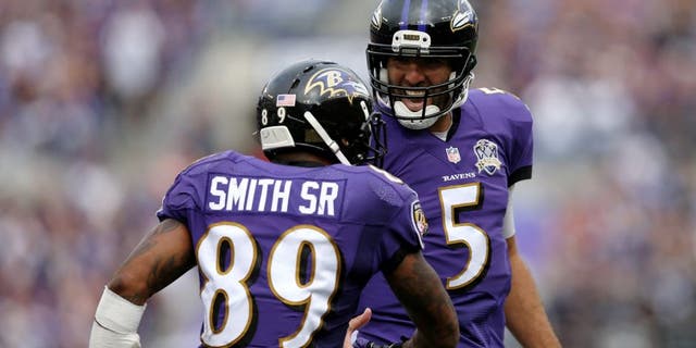 BALTIMORE, MD - SEPTEMBER 27: Wide receiver Steve Smith #89 of the Baltimore Ravens celebrates with quarterback Joe Flacco #5 of the Baltimore Ravens after scoring a fourth quarter touchdown during a game against the Cincinnati Bengals at M&T Bank Stadium on September 27, 2015 in Baltimore, Maryland. (Photo by Patrick Smith/Getty Images)