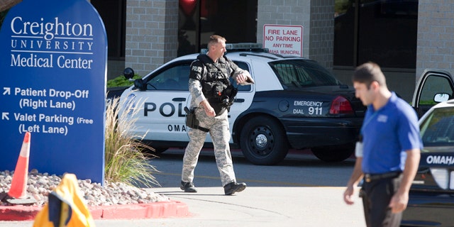 Sept. 29: A police SWAT team member walks out of the Creighton University medical center in Omaha, Neb.