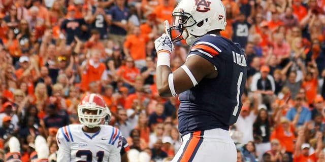 Sep 27, 2014; Auburn, AL, USA; Auburn Tigers wide receiver D'haquille Williams (1) celebrates a touchdown during the first half against the Louisiana Tech Bulldogs at Jordan Hare Stadium. Mandatory Credit: Shanna Lockwood-USA TODAY Sports