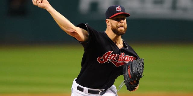 Sep 28, 2015; Cleveland, OH, USA; Cleveland Indians starting pitcher Corey Kluber (28) throws a pitch during the first inning against the Minnesota Twins at Progressive Field.